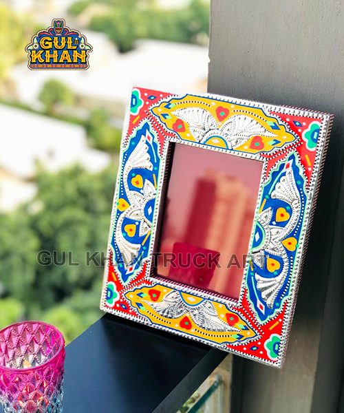 Decorative rectangular wall mirror with colorful truck art frame and Urdu text with date 15/10/2023