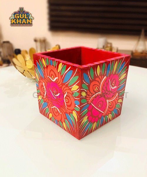 Handpainted wooden cutlery holder with vibrant floral patterns in red, pink, blue, and green colors